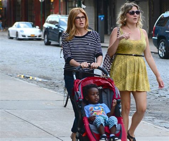CONNIE BRITTON STROLLS ALONG WITH SON EYOB