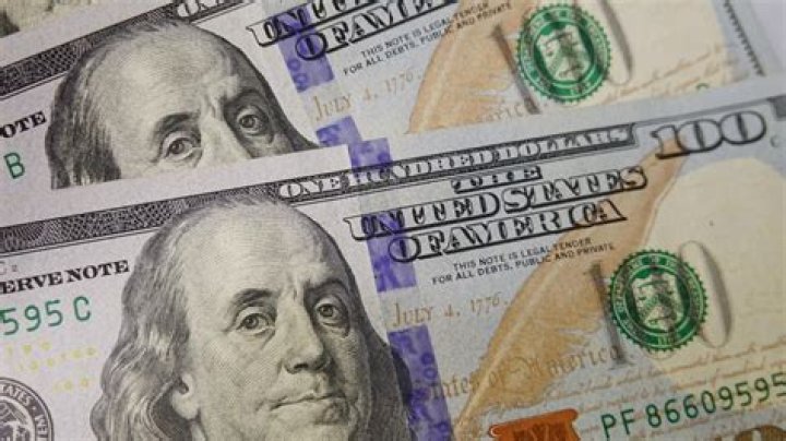 US dollar hits new 20-month high, tops 85 yen