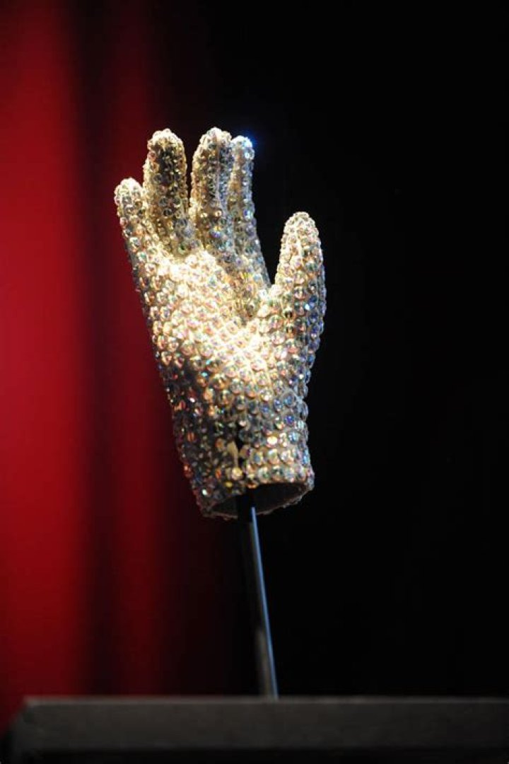 Why did Michael Jackson wear his iconic single white glove?
