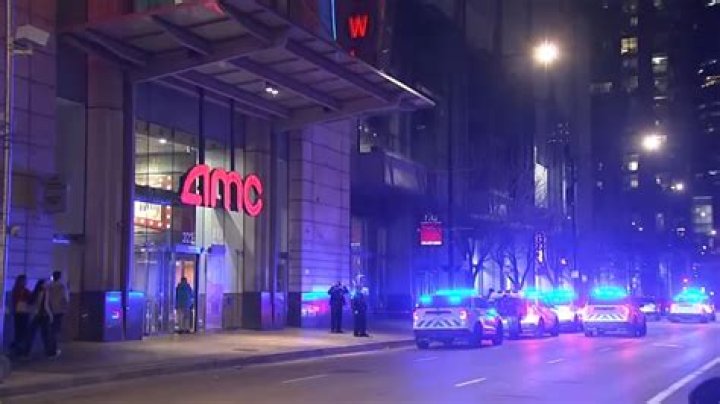 	WOMAN SHOT NEAR THEATER	